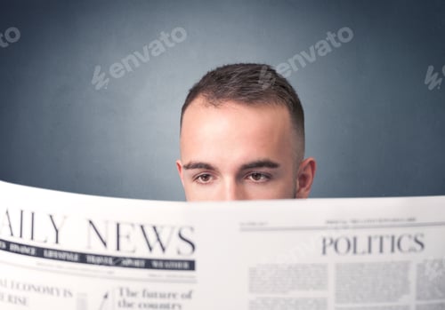 Preview: Young Smart Businessman Reading Daily Newspaper