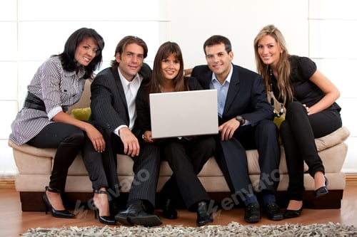 Preview: Businessteam Sitting On A Couch With A Laptop