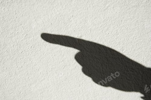 Preview: Shadow Of Human Hand With Pointing Finger On Whitewashed Wall