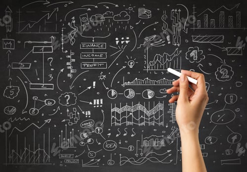 Preview: Female Hand Holding White Chalk In Front Of A Blackboard With A Business Plan Drawn On It