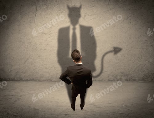Preview: An Experienced Tricky Businessman In Suit Looking At His Devil Desguise Shadow Reflected On The
