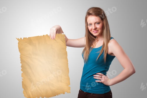 Preview: Beautiful Young Girl Presenting Old Paper Copy Space