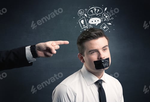 Vista previa: Caucasian Business Hand Pointing At Stressed Male Employee With Drawn Question, Explamation Marks