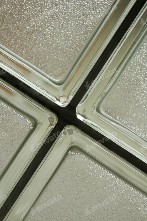 Preview: Corners Of Four Opaque Bathroom Windows With Silver Frames