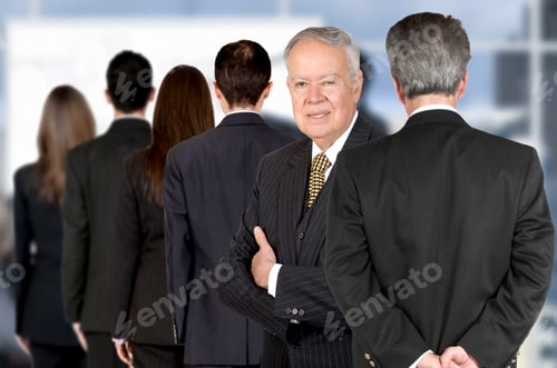 Preview: Business Team All Facing Backwards Apart From The Boss