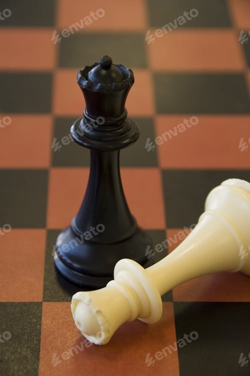Preview: Black Queen Stands Victorious Over Fallen White Queen On Chessboard