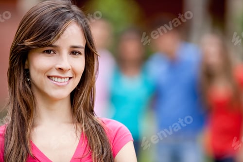 Preview: Portrait Of A Casual Woman Smiling Outdoors