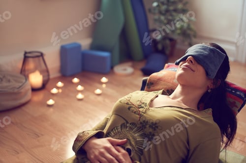 Preview: Attractive Mixed Race Woman Doing Restorative Yoga
