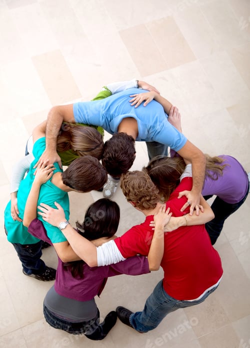 Preview: Picture Of A Team Of People Hugging Indoors