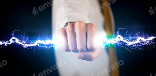Preview: Business Man Holding Electricity Light Bolt In His Hands Concept