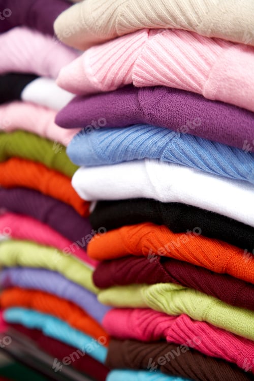 Preview: Folded Multicolour Clothes In A Retail Store