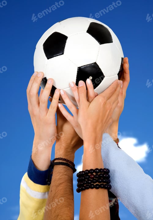 Preview: Hands Holding A Football With A Blue Sky In The Background