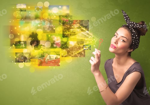 Preview: Cute Girl Blowing Colourful Glowing Memory Picture Concept On Green Background