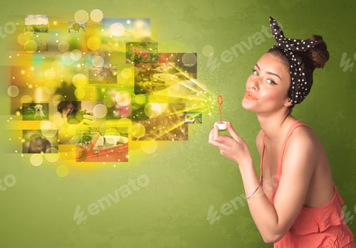Preview: Cute Girl Blowing Colourful Glowing Memory Picture Concept On Green Background