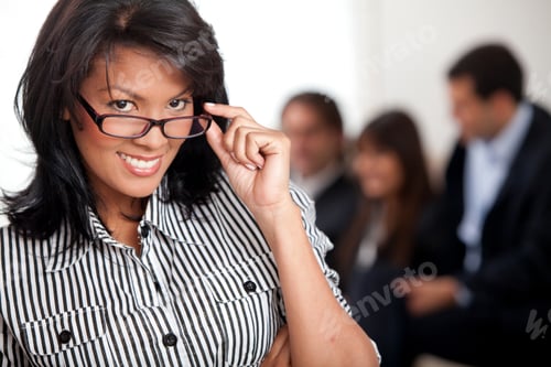 Preview: Smart Business Woman With A Group Behind Her
