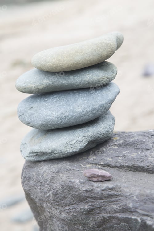 Preview: Stack Of Four Stones On Beach