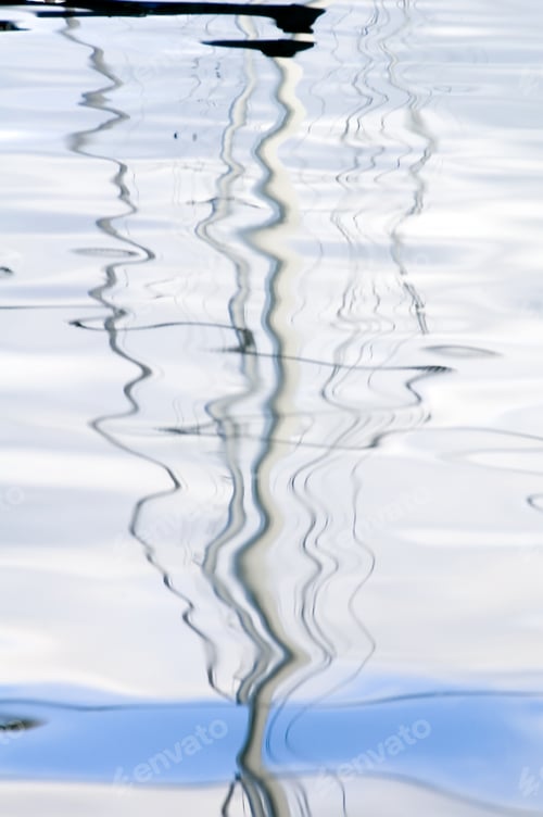 Preview: Squiggly Reflections Of Mast And Lines Of Sailboat In Marina