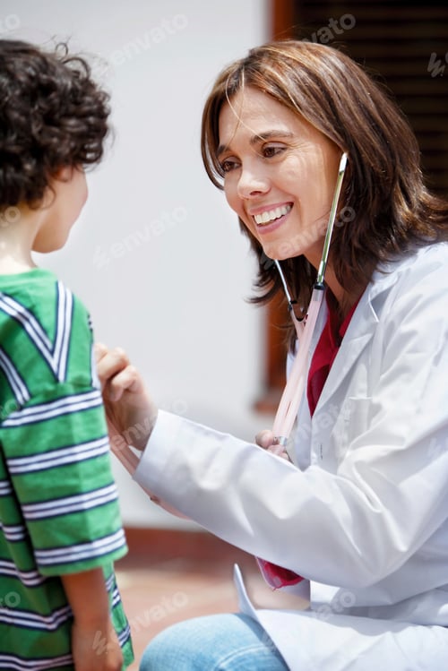 Preview: Female Doctor Assessing A Patient With A Stethoscope