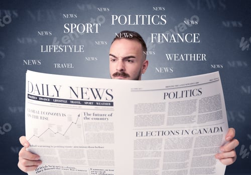 Preview: Young Smart Businessman Reading Daily Newspaper