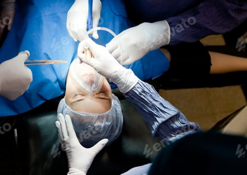 Preview: Woman In Surgery Breathing Through An Oxygen Mask