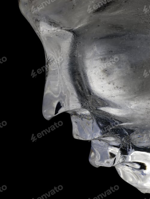 Preview: Profile Of Human Face In Ice Against A Black Background
