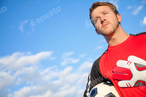Preview: Football Or Soccer Goalkeeper Holding The Ball Outdoors