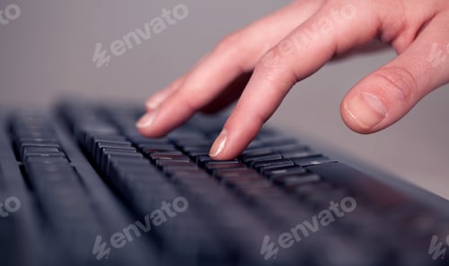 Preview: Close Up Of Hand Pressing Keyboard Buttons On Desk