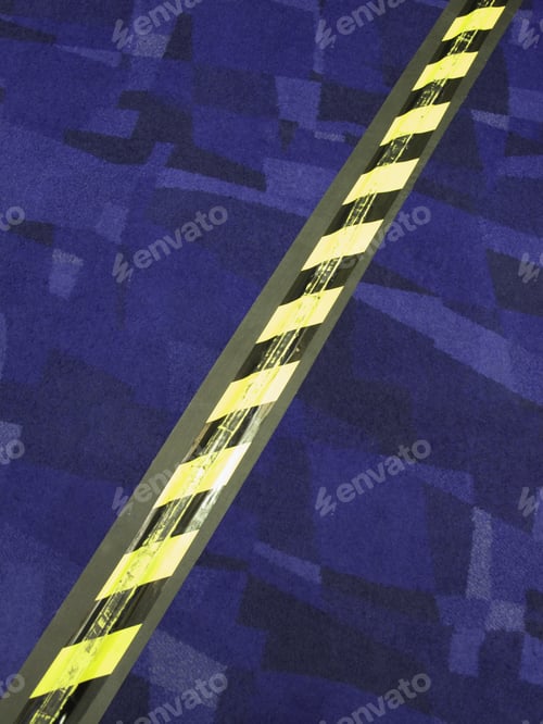 Preview: Striped Safety Tape Over Electrical Cord Across Carpet In Convention Center