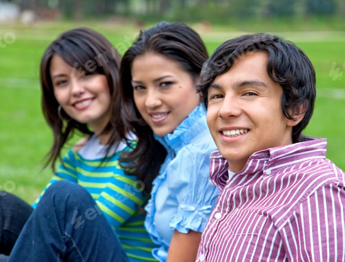 Preview: Casual Group Of People Sitting Outdoors And Smiling