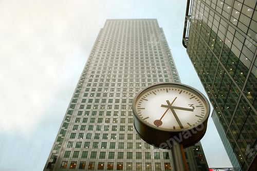Preview: Clock In Front Of A Corporate Building