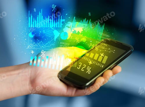 Preview: Hand Holding Smartphone With Business Diagrams On It