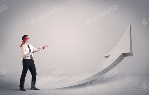 Preview: A Scared Blindfolded Businessman Forced To Face A Problem Concept With Illustrated Arrow Pointng To