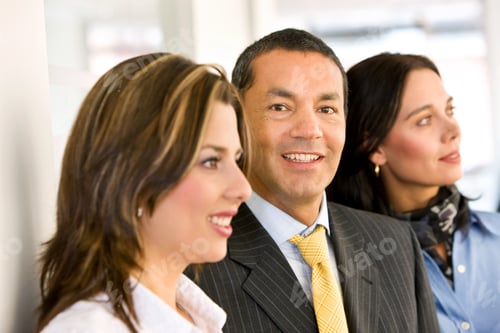Preview: Small Group Of Business People Smiling At The Office