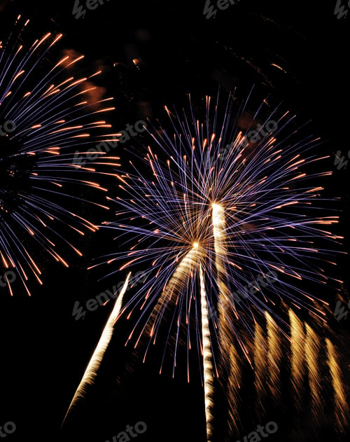 Preview: Bursts Of Blue Fireworks With Rocket Trails And Fiery Tips