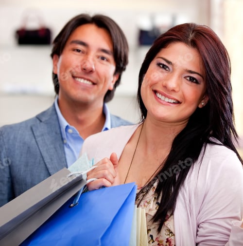 Preview: Beautiful Shopping Couple Holding Bags And Smiling