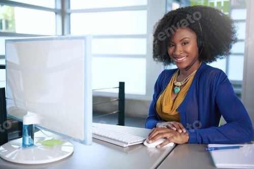 Preview: Portrait Of A Smiling Customer Service Representative With An Afro At The Computer Using Headset