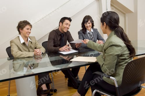 Preview: Woman Handing Over Resume At Meeting.