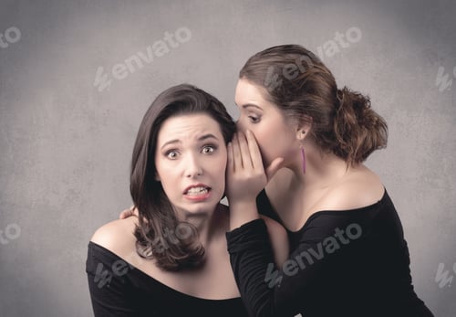Preview: Two Fancy Dressed Actress Girls With Long Hair And Make Up Whispering In Front Of Grey Urban