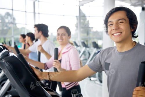 Preview: Group Of People At The Gym Doing Exercise On The Machines