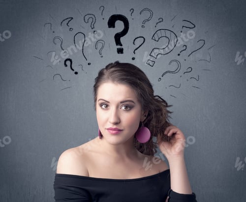 Preview: A Pretty Teenage Girl Standing Confused In Front Of Grey Wall Background With Drawn Question Marks