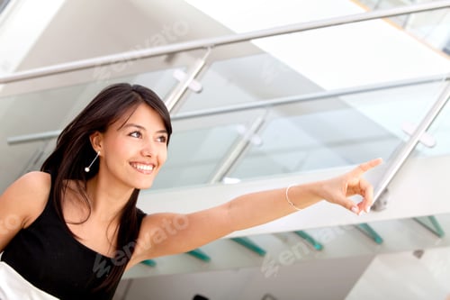Preview: Business Woman Pointing At Something At The Office