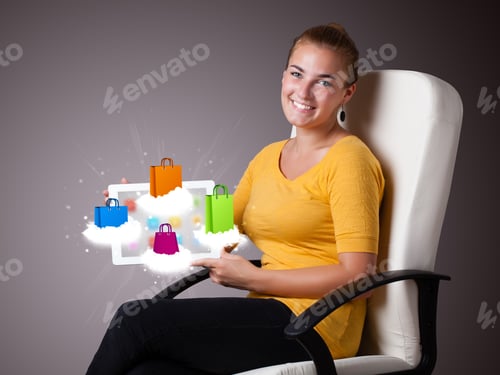 Preview: Beautiful Woman Holding Modern Tablet With Colorful Shopping Bags On Clouds