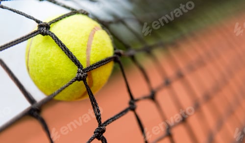 Preview: Tennis Ball Stuck On The Net At A Clay Court