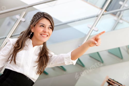 Preview: Business Woman Pointing At Something At The Office