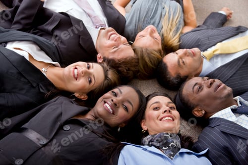 Preview: Multi-Ethnic Business Teamwork In An Office With Heads Together On The Floor