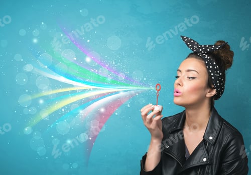 Preview: Beautiful Girl Blowing Abstract Colorful Bubbles And Lines On Blue Background