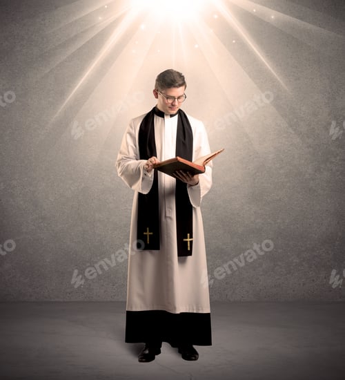 Preview: A Male Religious Young Priest In Black And White Dress Giving His Blessing, Holding The Holy Bible