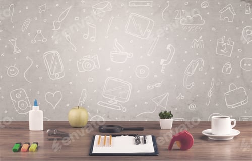Preview: Close Up Of Business Office Desk With Laptop Tablet In Front Of Brown Wall Background Full Of Drawn