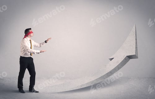 Preview: A Scared Blindfolded Businessman Forced To Face A Problem Concept With Illustrated Arrow Pointng To