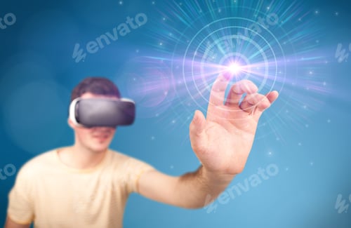 Preview: Young Impressed Man Wearing Virtual Reality Goggles With Blue Circles Around His Finger